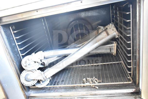 Blodgett Mark V full-size convection oven with view-through doors, thermostatic controls, legs on casters, in used condition.