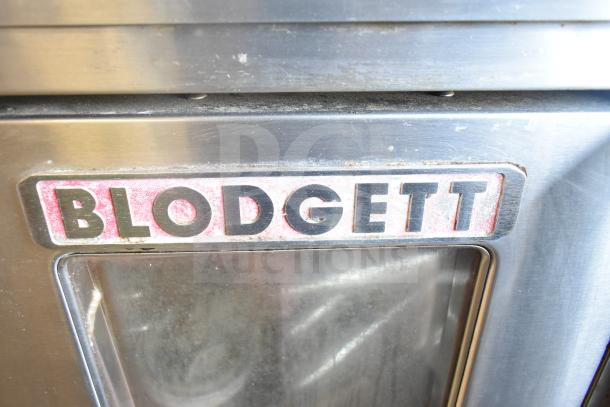 Blodgett Mark V commercial convection oven with view-through doors and thermostatic controls. Includes legs on casters.
