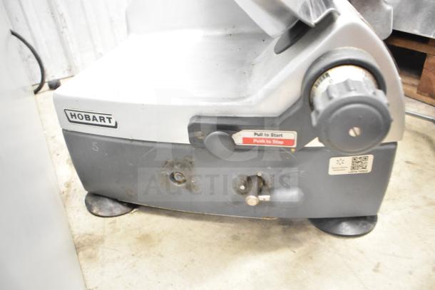 Hobart 2912 commercial meat slicer, 115 volts, 1 phase, with start/stop button and visible wear, ideal for countertop use.