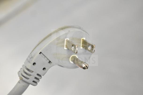 A close-up of a power plug attached to the Hobart 2912 meat slicer, indicating 115 volts, 1 phase.