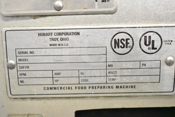 Hobart 2912 meat slicer label showing serial number 56-1209-739, 115V, 1 phase, NSF and UL listed, made in USA.