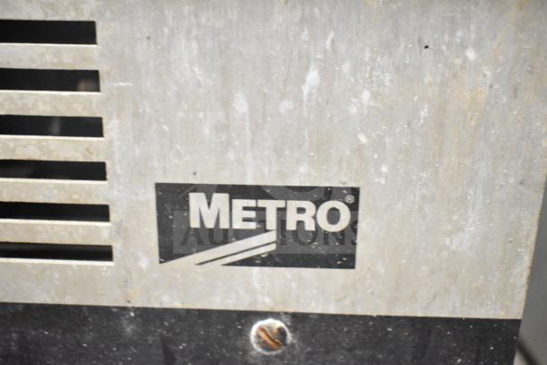 Metro C175-HM2000 commercial heated holding cabinet, visible Metro logo, 120 volts, 1 phase, on commercial casters.