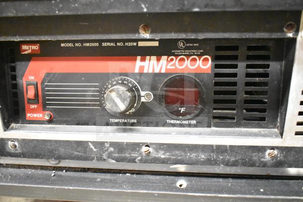 Metro C175-HM2000 heated holding cabinet control panel, features power switch, temperature dial, and thermometer display.