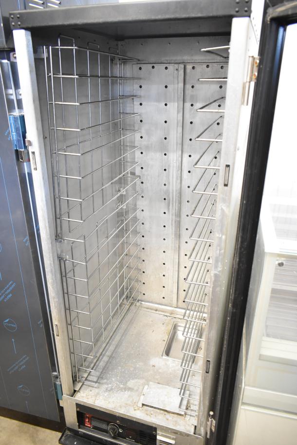 Metro C175-HM2000 commercial heated cabinet on casters. Features steel racks, 120 volts, 1 phase. Good condition.