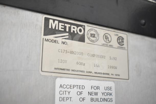 Metro C175-HM2000 heated holding cabinet label showing model info: 120V, 60Hz, 16A, 1990W; NSF, UL, CSA listed.
