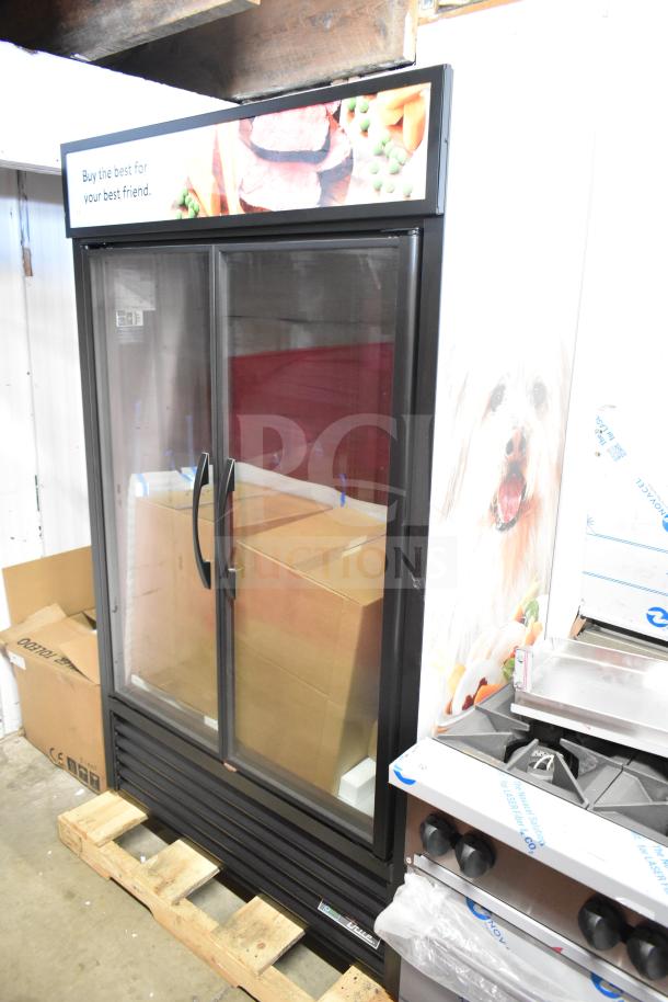 Brand new 2025 True TVM-48SL-HC commercial 2-door reach-in cooler merchandiser, 115V, 1 phase, with minor scratches and dents.