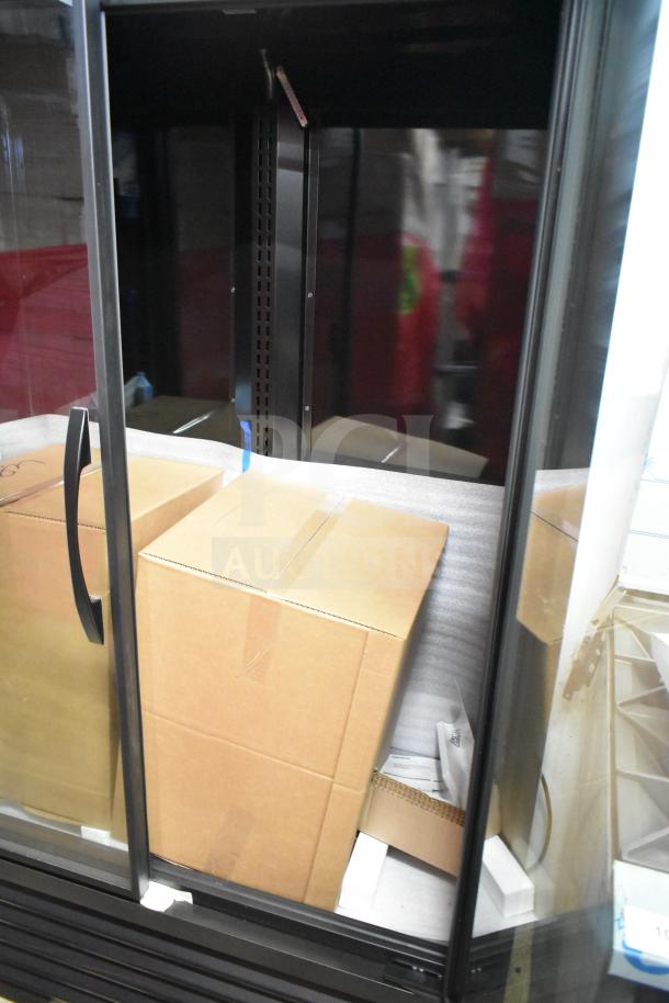 Brand new 2025 True TVM-48SL-HC commercial 2-door cooler merchandiser with minor scratches. 115V, 1 Phase.