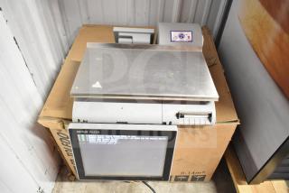 Mettler Toledo commercial countertop scale, stainless steel, tested and working, with display screen and control panel.