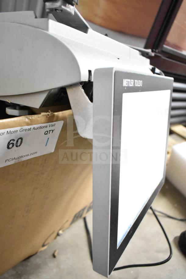 Mettler Toledo commercial countertop scale with digital display, tested and working, slight wear; auction tag visible.