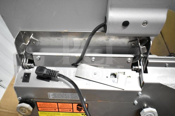 Mettler Toledo commercial countertop scale, tested and working, features power cord and port connections.