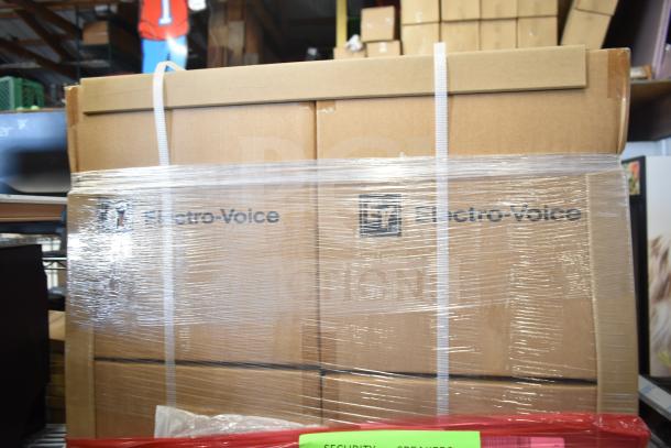 30 boxes of Electro-Voice EVID-P6.2UW pendant speakers in original packaging, labeled "Scratch and Dent," wrapped for auction.