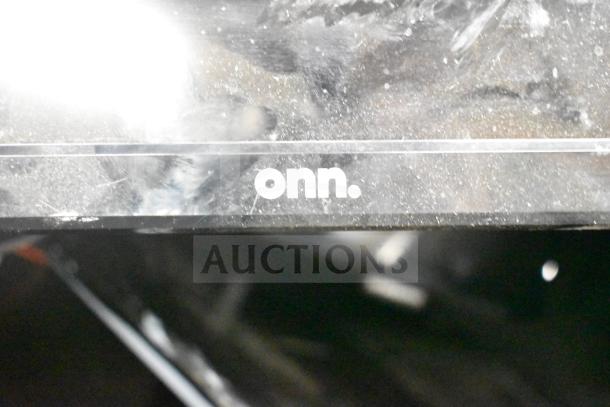 Onn monitor with company logo visible on its dusty surface, part of 27 various items auction lot.