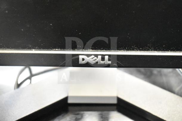 Dell computer monitor, black frame, visible Dell logo, part of a lot of 27 items including Onn and HP monitors.