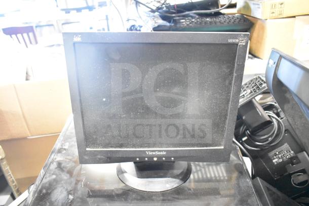 ViewSonic VA503b monitor with visible screen dust, part of a lot of 27 various computer items.