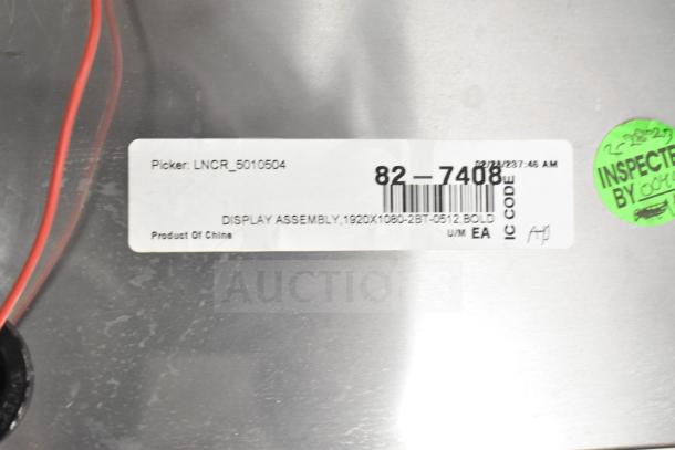 Label close-up on the back panel of a monitor, indicating "DISPLAY ASSEMBLY, 1920X1080" and "Product Of China".