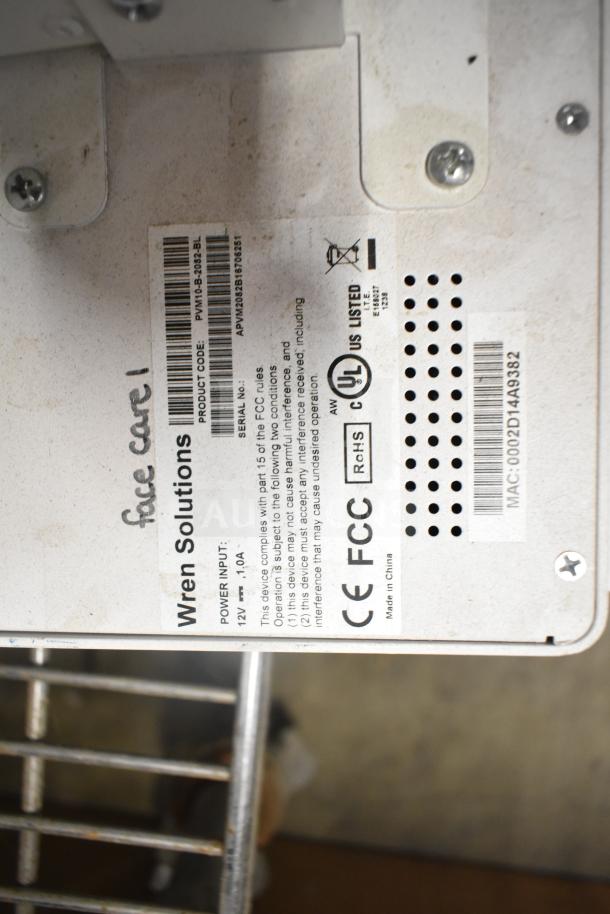 Security system component from Wren Solutions, showing labels with product code PWM10-3-2023-BL, UL listed, 12V 1.0A power input.