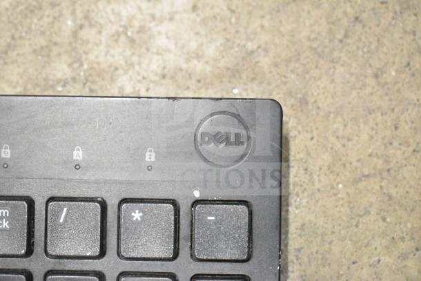 Dell keyboard corner with logo; black keys, slightly worn. Part of 26-item lot including keyboards and mice.