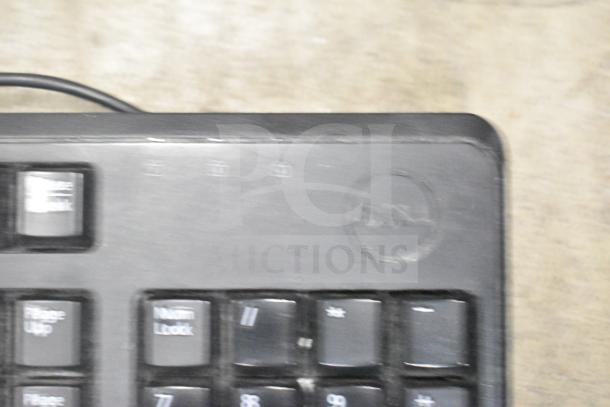 26 items set featuring Dell computer keyboards and a mouse, used condition, Dell logo visible on keyboard.