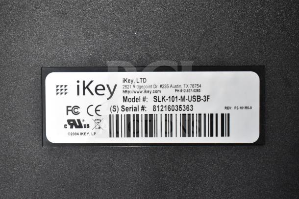 iKey SLK-101-M-USB-3F model label with serial number 81216035363, displaying certifications and company details.