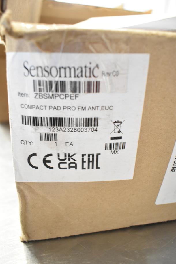 Sensormatic ZBSMPCPEF Compact Pad Pro in box, item label visible with details and barcodes, new condition. Quantity: 1.