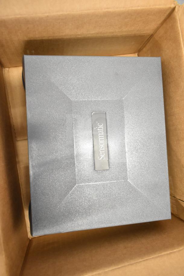 Sensormatic ZBSMPCPEF Compact Pad Pro in box, gray, with Sensormatic logo embossed on top.
