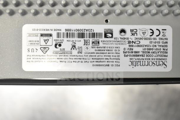 Sensormatic ZBSMPCPEF Compact Pad Pro label, showing model details, serial number, manufacturing info. Key auction item.