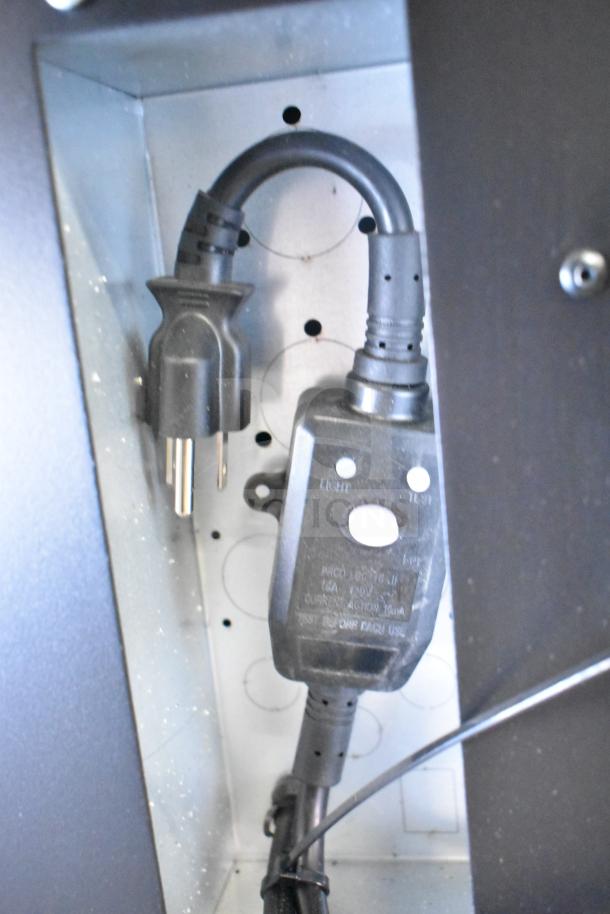 Power cord and outlet inside KoolMore commercial vending machine, brand new with minor scratches and dents.