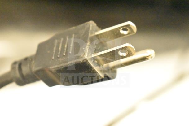 Close-up image of a plug, likely from the 2024 Hobart HTi-7LH4W commercial scale. Plug type indicates electrical compatibility.
