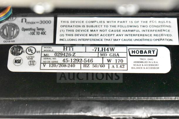 2024 Hobart HTi-7LH4W countertop food portioning scale label showing model and voltage specifications.