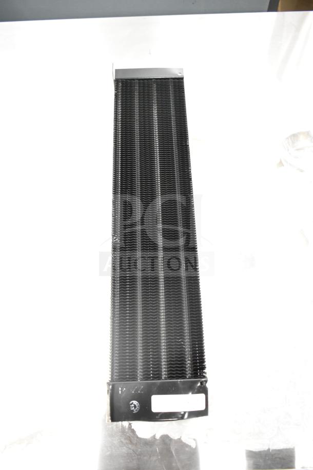 ```plaintext
Brand new Avantco 177PMG225 evaporator coil, visible markings, minor dents, ideal for replacement or repair.
```