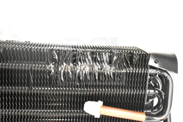 Brand new Avantco 177PMG225 evaporator coil with visible dents. Metal construction, part of a scratch and dent auction.