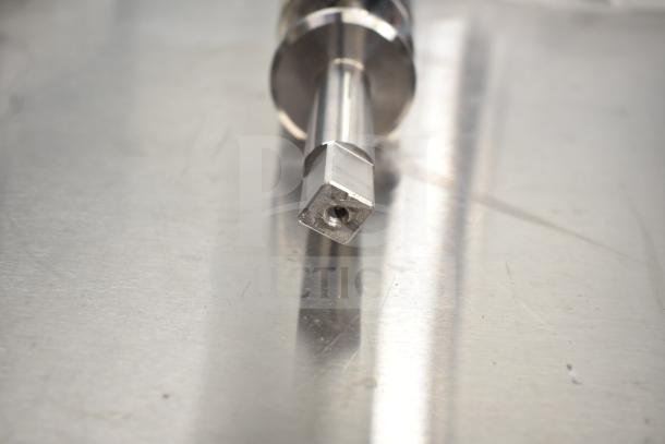 Brand new Avantco 177PMG225 Auger on metal surface, scratch and dent condition.