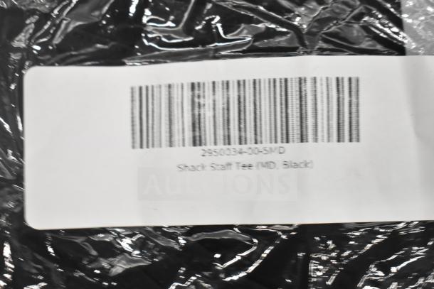 Scratch and dent Shack Staff Tee in size MD, model 2950034-00-5MD. Label shows barcode and size details.