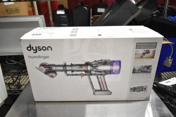 Dyson Humdinger Vacuum Cleaner box, showing product image and features. Clean, unopened packaging.