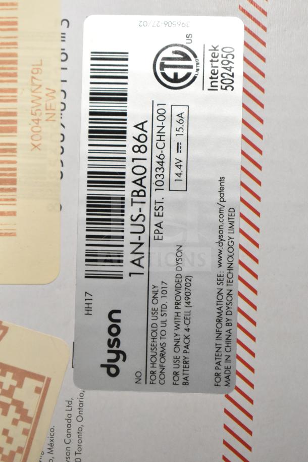 Label on Dyson Humdinger Vacuum Cleaner box, showing model TBA0186A, EPA EST 103346-CHN-001, 14.4V, 15.6A, UL certified.