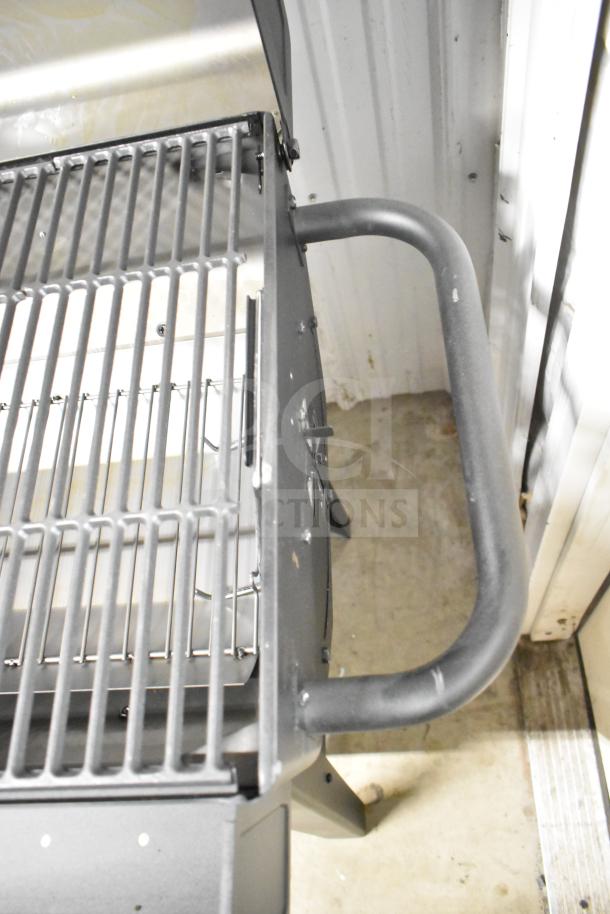 Char-Griller CG30282925 FlexFuel black combo grill, featuring liquid propane and charcoal options, visible grill grates and handle.