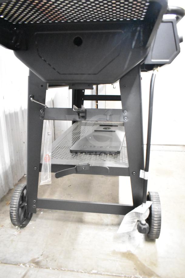 Char-Griller CG30282925 FlexFuel black combo grill, using liquid propane and charcoal, shown in good condition.