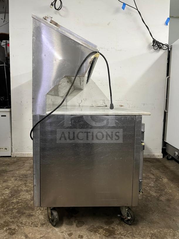 Marsal & Sons refrigerated pizza prep table, model Pizza Prep, stainless steel, caster wheels, used condition.