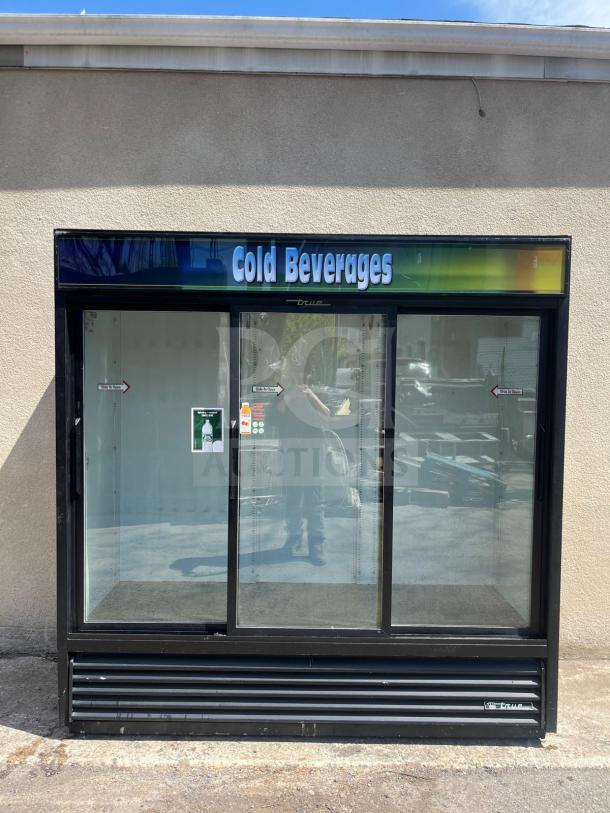 True GDM-69 glass door merchandiser with three sliding doors, 78" wide, black finish, labeled for cold beverages, model GDM-69.