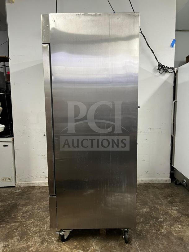 Arctic Air AF49 reach-in freezer, stainless steel exterior, 2 solid doors, on casters, used condition.
