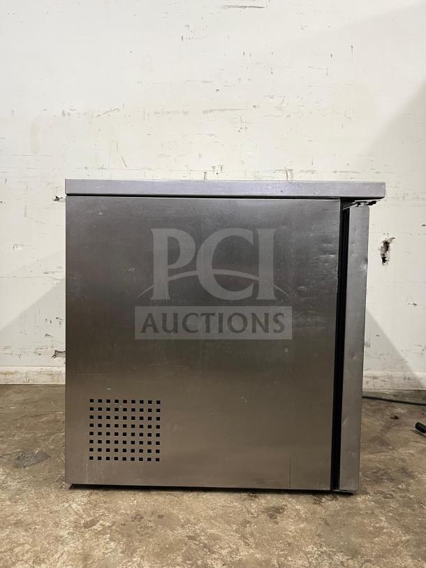 True TUC-36 undercounter cooler, stainless steel, two doors, used condition, model details visible on front panel.