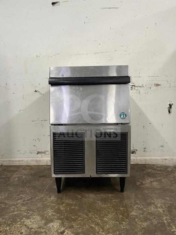 Hoshizaki self-contained 24" air-cooled ice machine, cube shaped, stainless steel, front view, visible vents, used condition.