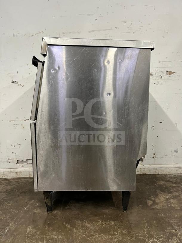 Hoshizaki 24" self-contained air-cooled ice machine, cube shape, stainless steel, visible wear, model unspecified.