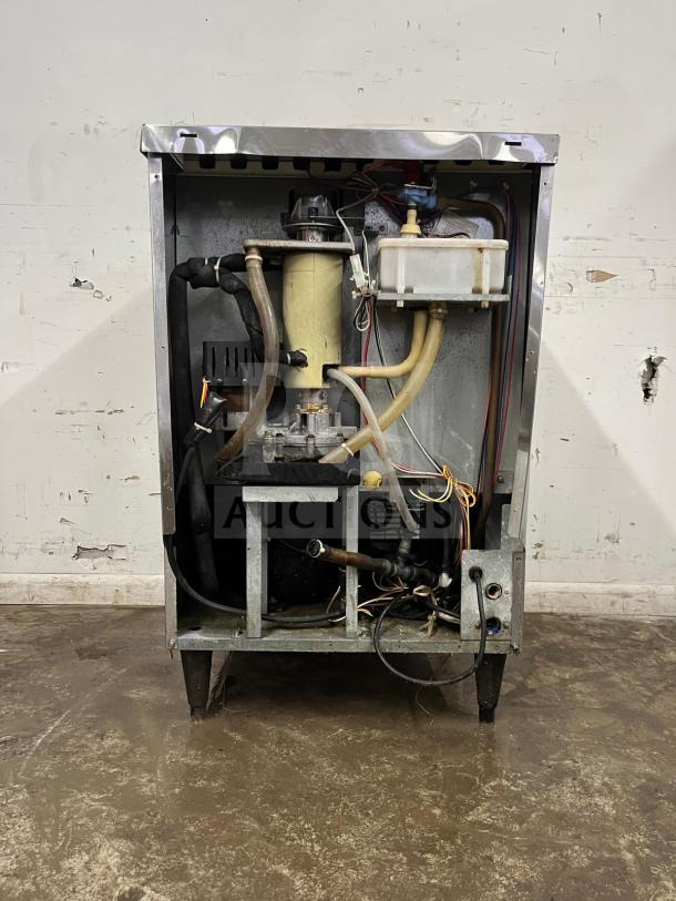 Hoshizaki 24" air-cooled cube ice machine, open back view, showing internal components. Used condition with visible wear.