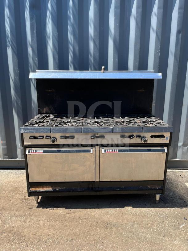 Garland Natural Gas 10 Burner 60" Range with Two Ovens, 406,000 BTU. Features Garland branding, fair condition.
