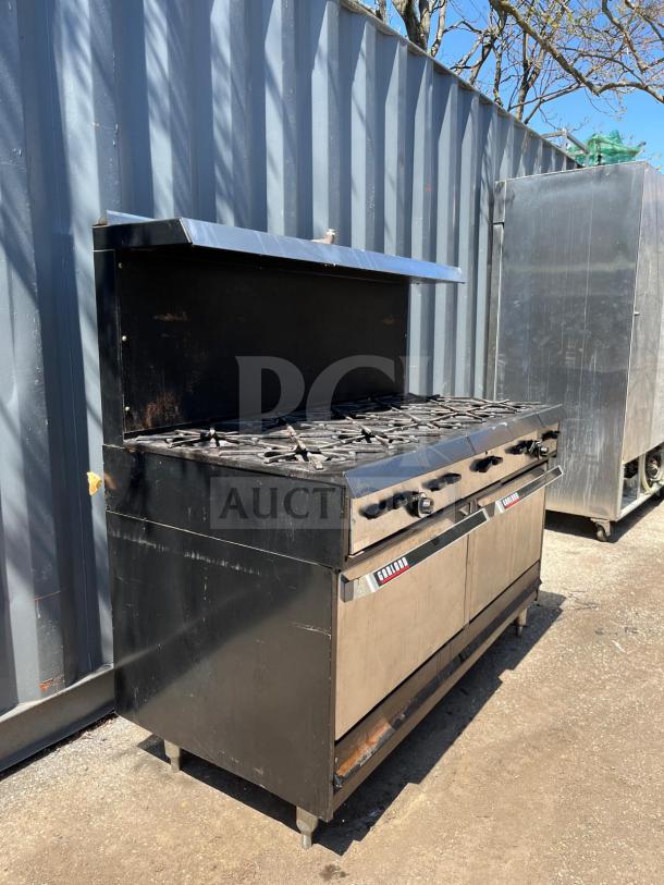 Garland Natural Gas 10 Burner 60" Range with two ovens, 406,000 BTU, black and stainless steel, used condition.