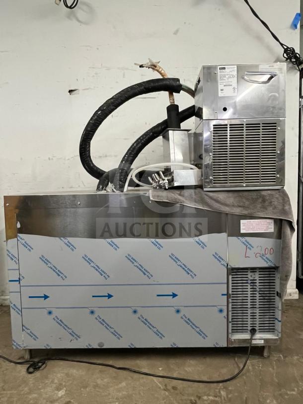 Perlick DDS60 60" black direct draw beer dispenser. Holds five 1/4 kegs. Features include cooling unit and hoses. Used condition.