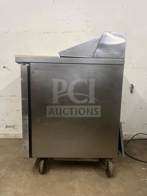 True TSSU-27-08-HC 27" refrigerated sandwich prep table, right-hinged door, stainless steel, casters, used condition.