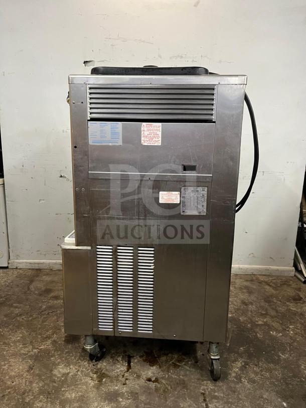 Taylor 342D double flavor frozen drink machine for margaritas and milkshakes. Stainless steel, used condition, visible labels.