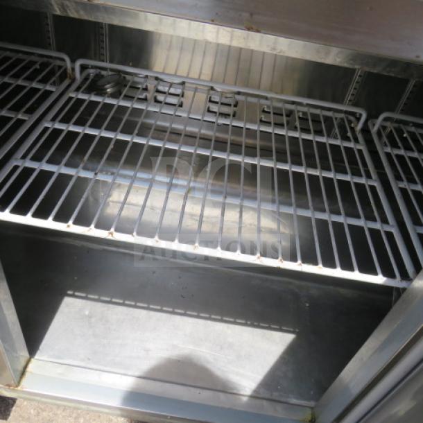 Avantco 3-door refrigerated prep table, model 178SSPT71HC, on casters. Interior shelving, 71"x30"x42", 115V.